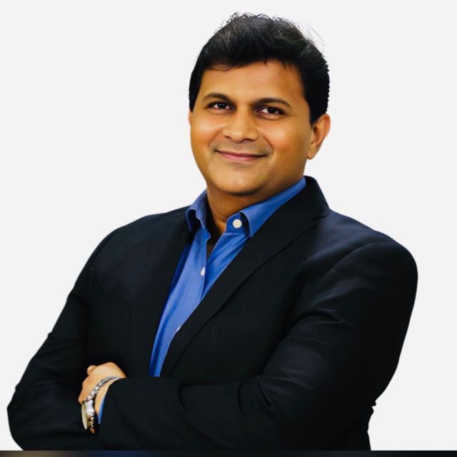 Dr. Darshan Desai - Ayurvedic skin specialist examining patient with psoriasis at AyuMD clinic Borivali Mumbai